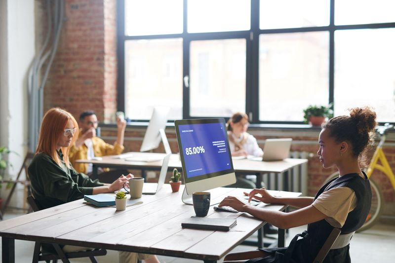 Bright open-plan workspace where the Coral Gables recruiting team works