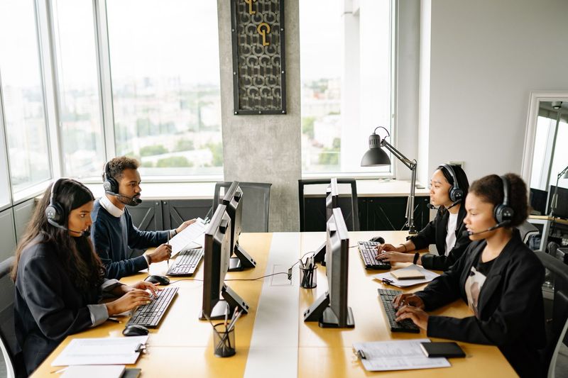Rows of staffed workstations filled through a high-volume recruitment campaign