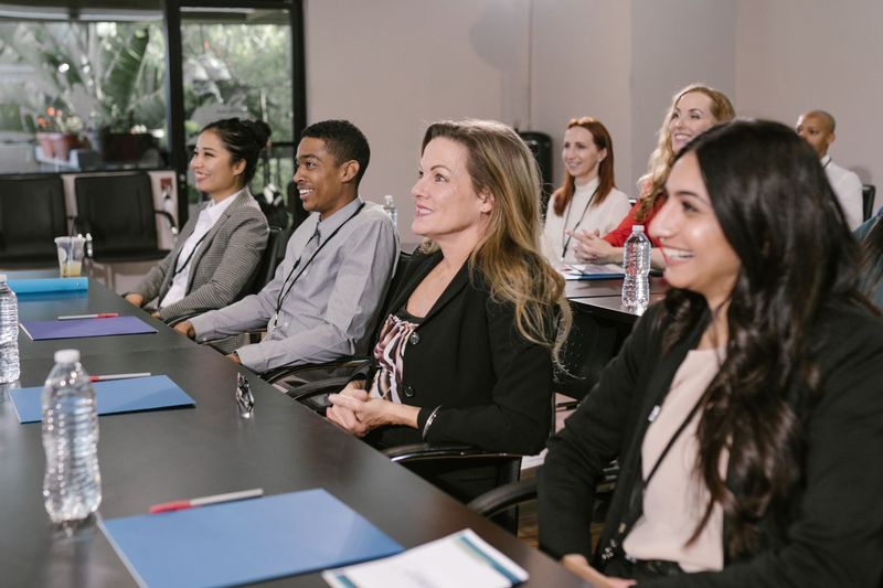 Shortlisted candidates seated in a conference room during a high-volume hiring day