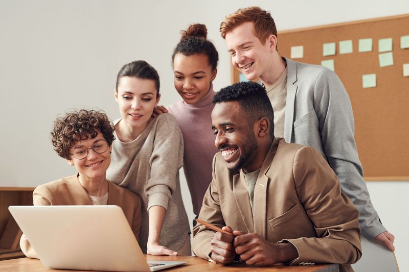 Recruiting team reviewing a client&rsquo;s open role together on a laptop